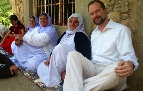 people sitting against wall