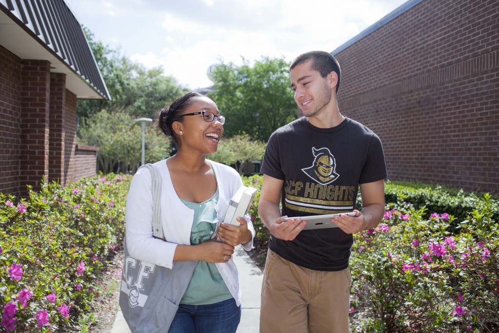 Two students walking through Farrell Commons
