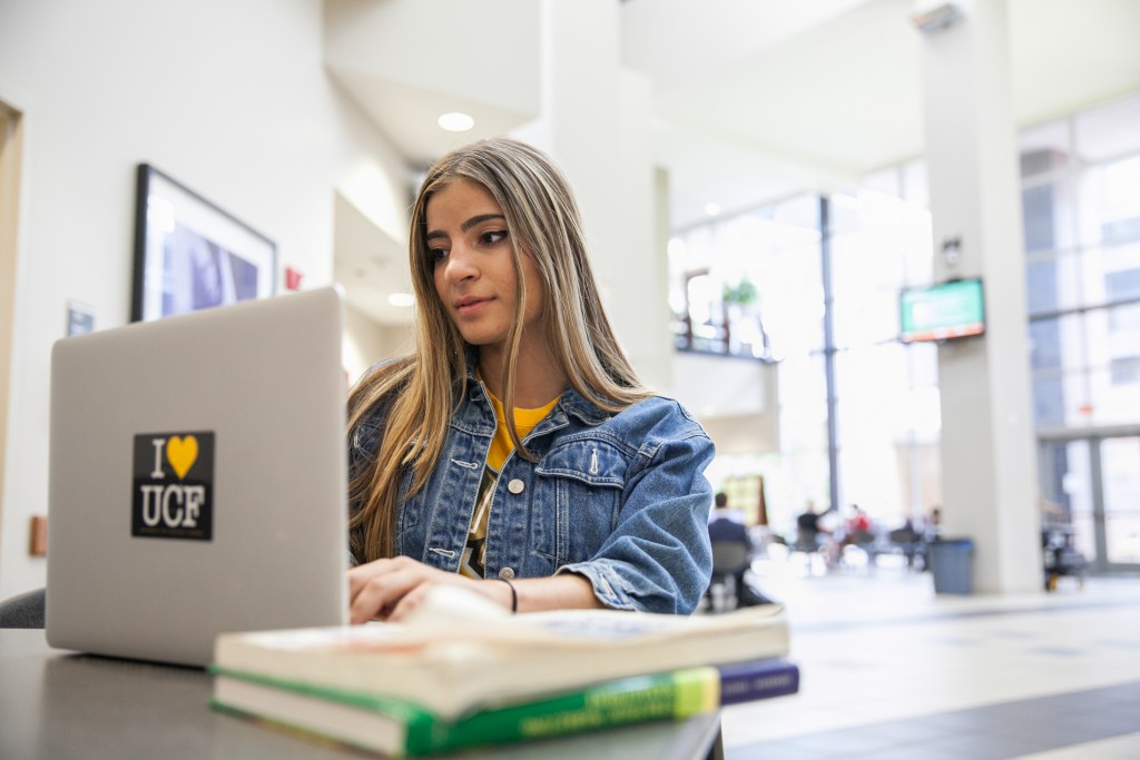 student studies inside the business building