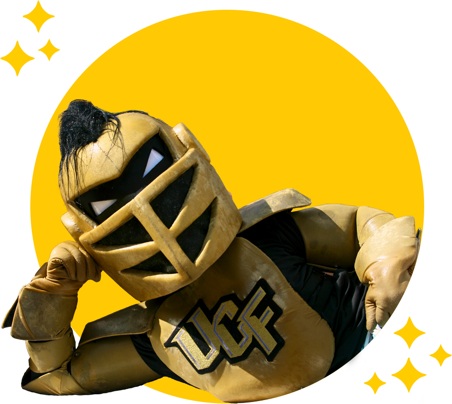 Knightro laying down in UCF Gold circle