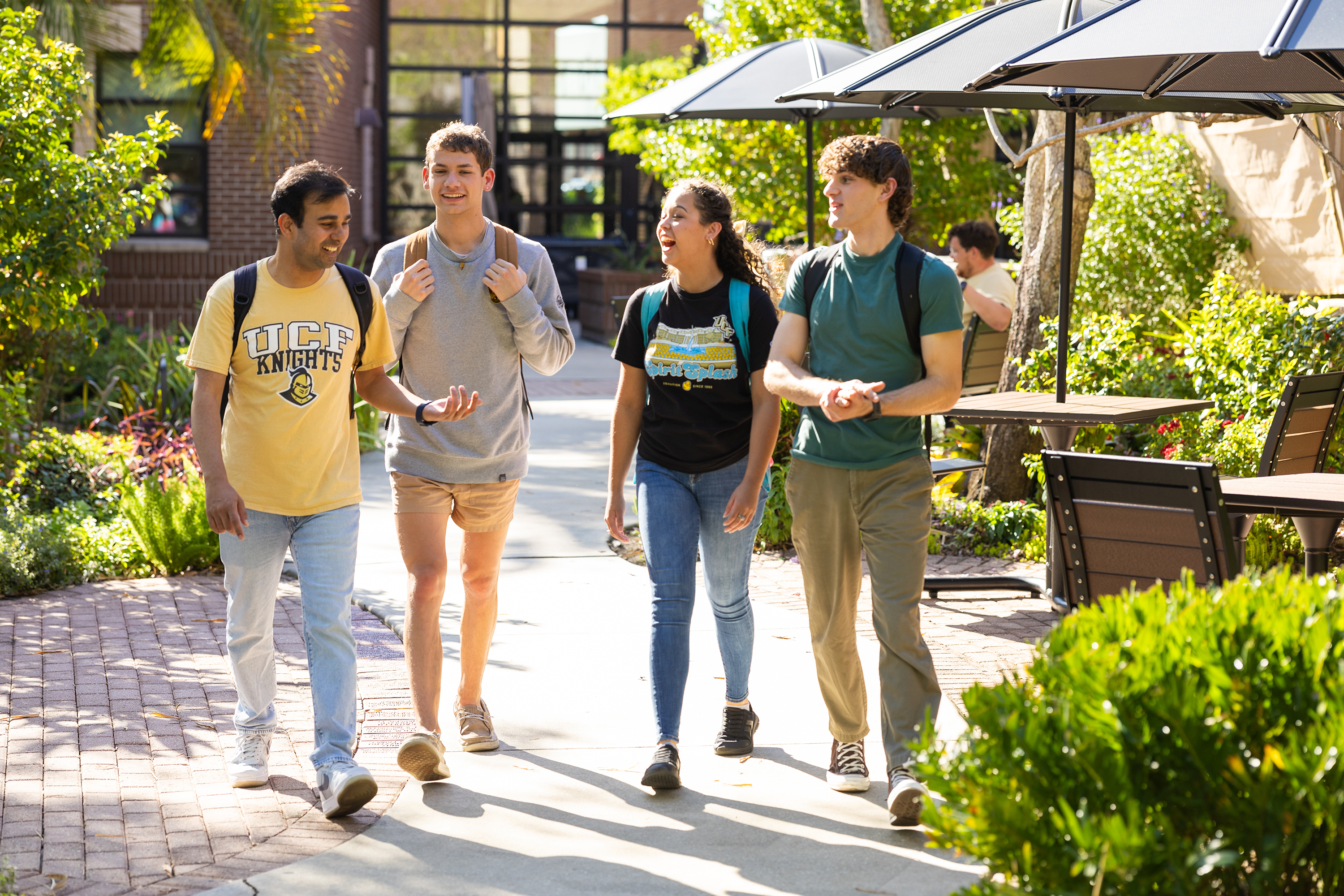 Group of UCF students walking and talking